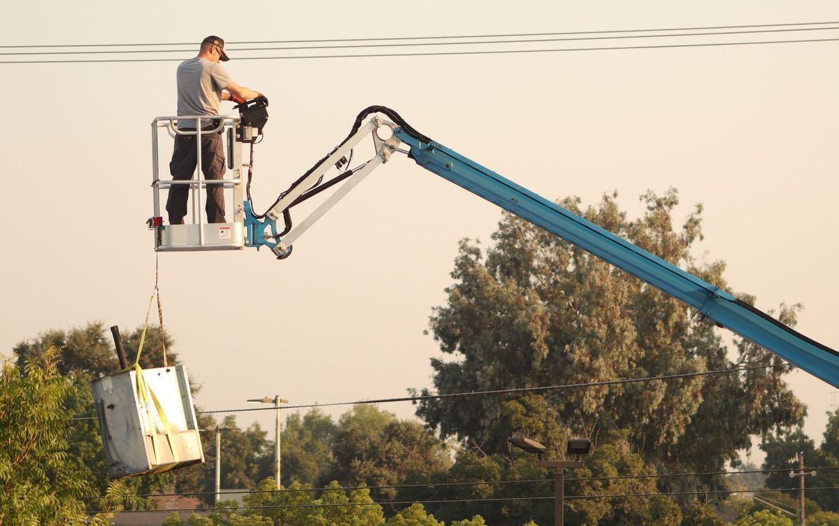 Commercial HVAC equipment installation with a lift in Phoenix, AZ by Mesa AC Repair