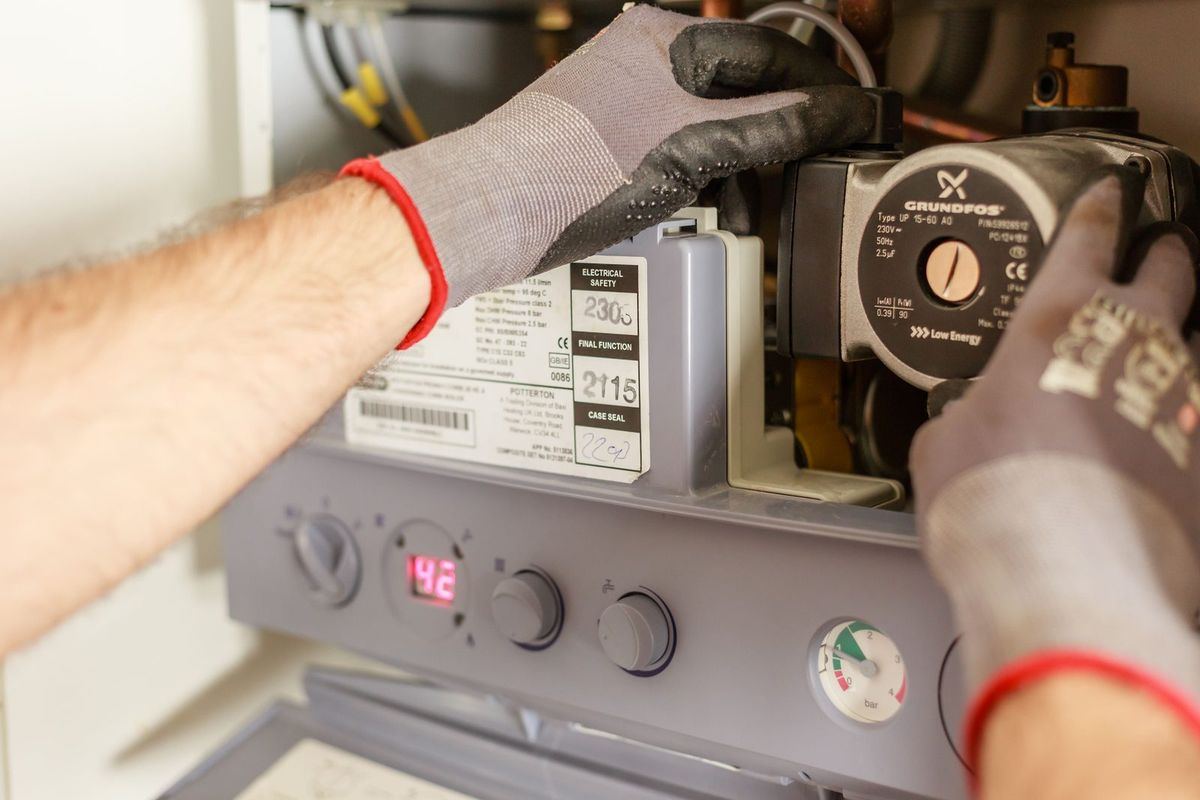 Mesa AC Repair technician servicing a heating and cooling system in Scottsdale, AZ